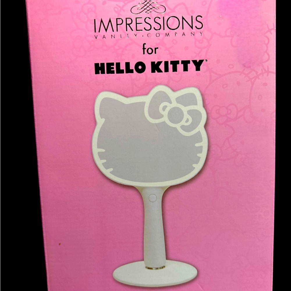 Impressions Hello Kitty LED hand mirror with
standing base